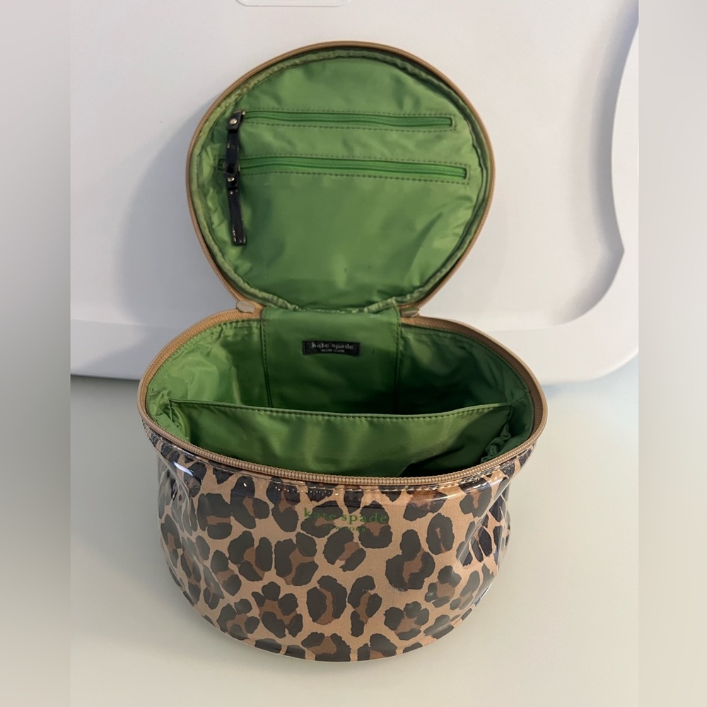 Kate Spade cosmetic bag. Rare shape. Leopard print & green lining/trim.